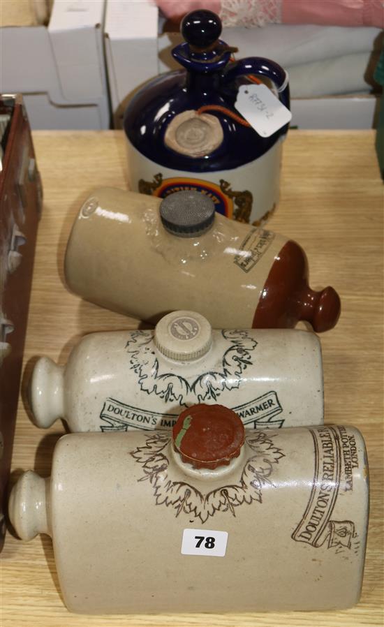 Four pottery vessels, including two Doulton foot warmers